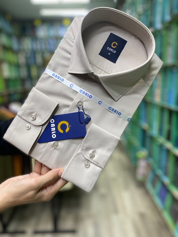 پیراهن مردانه تترون ساده کرم روشن آستین بلند تک جیب homaymen